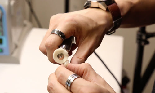 Dental polishing disc in use for finishing restorations