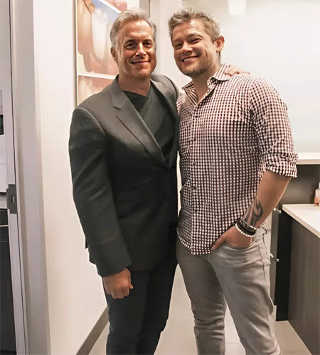 Company leadership team members standing together at VH Technologies office